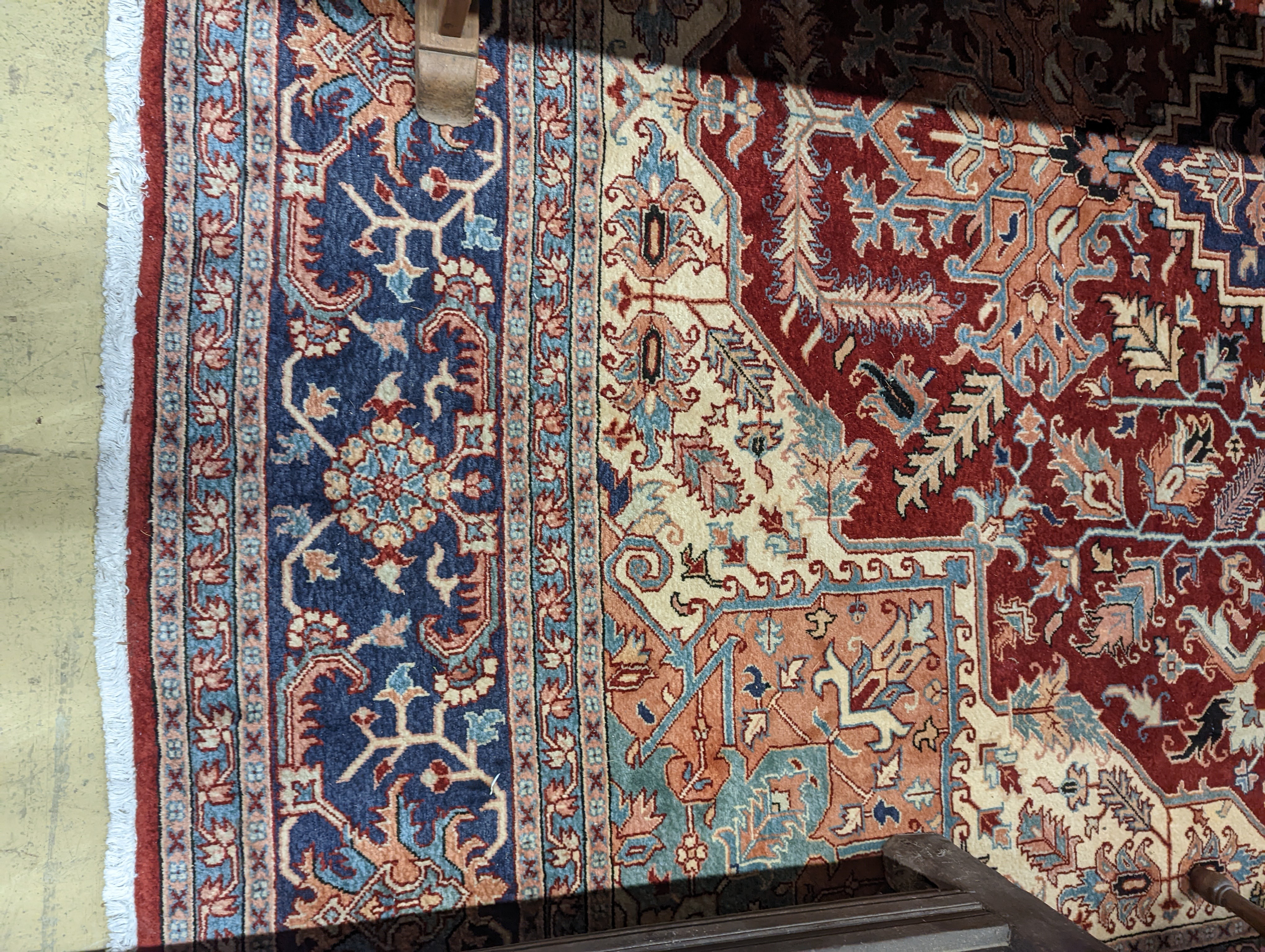 A large Caucasian style red ground carpet, 460 x 330cm
